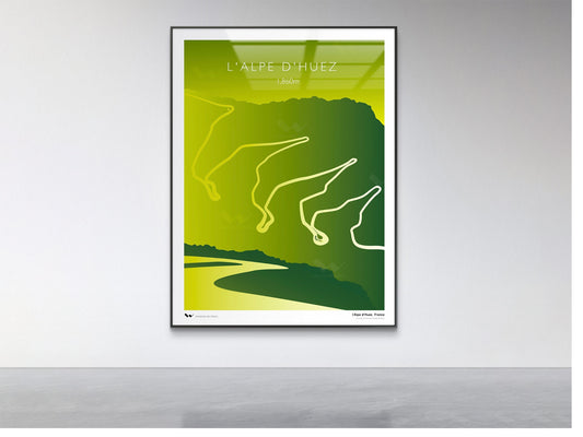 Framed green and white poster of a mountain landscape on a gray wall