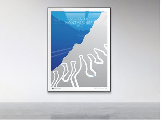 Framed poster of Lacets de Montvernier on a gray wall