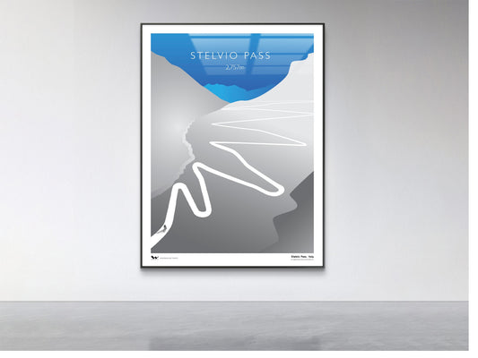 Framed poster of a mountain pass design on a gray wall