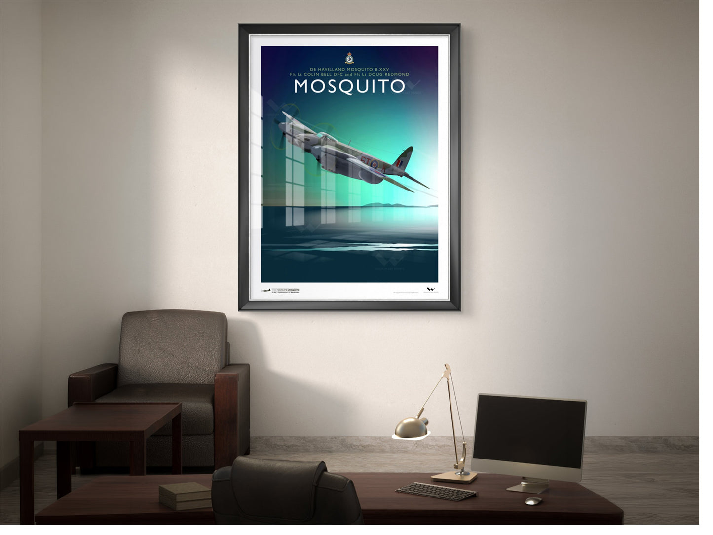 Framed art print of a de Havilland Mosquito, shown in a lounge/office room setting.